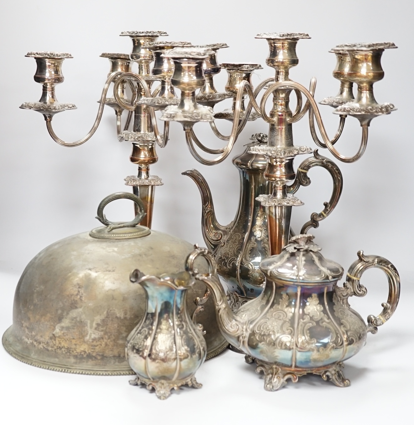 A quantity of silver plated wares to include a three piece tea set, tureen cover and pair of candelabra, 42cm CITES Submission reference S7EVMP55